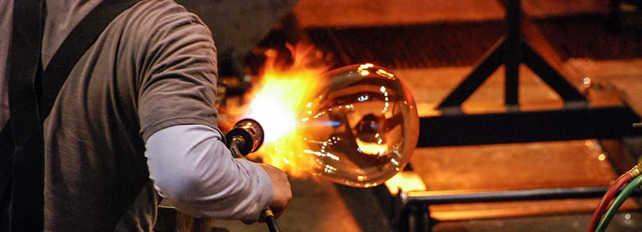 Glass blower working at the Tacoma, Washington Museum of Glass